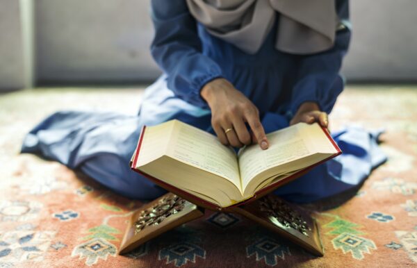Muslim woman reading from the quran